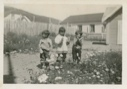 Image of Children outside MacMillan's School, showing off new mittens